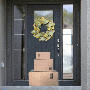 Houston Katy home exterior with three stacked packages by the front door