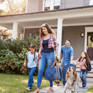 family with dog leaving their home in Katy, Texas