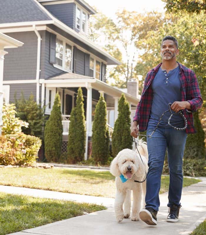 man walking dog