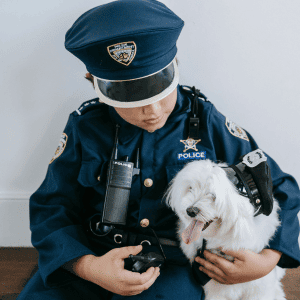 boy and dog in police officer costumes Katy, TX