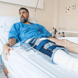 person in hospital bed after knee surgery Katy, TX
